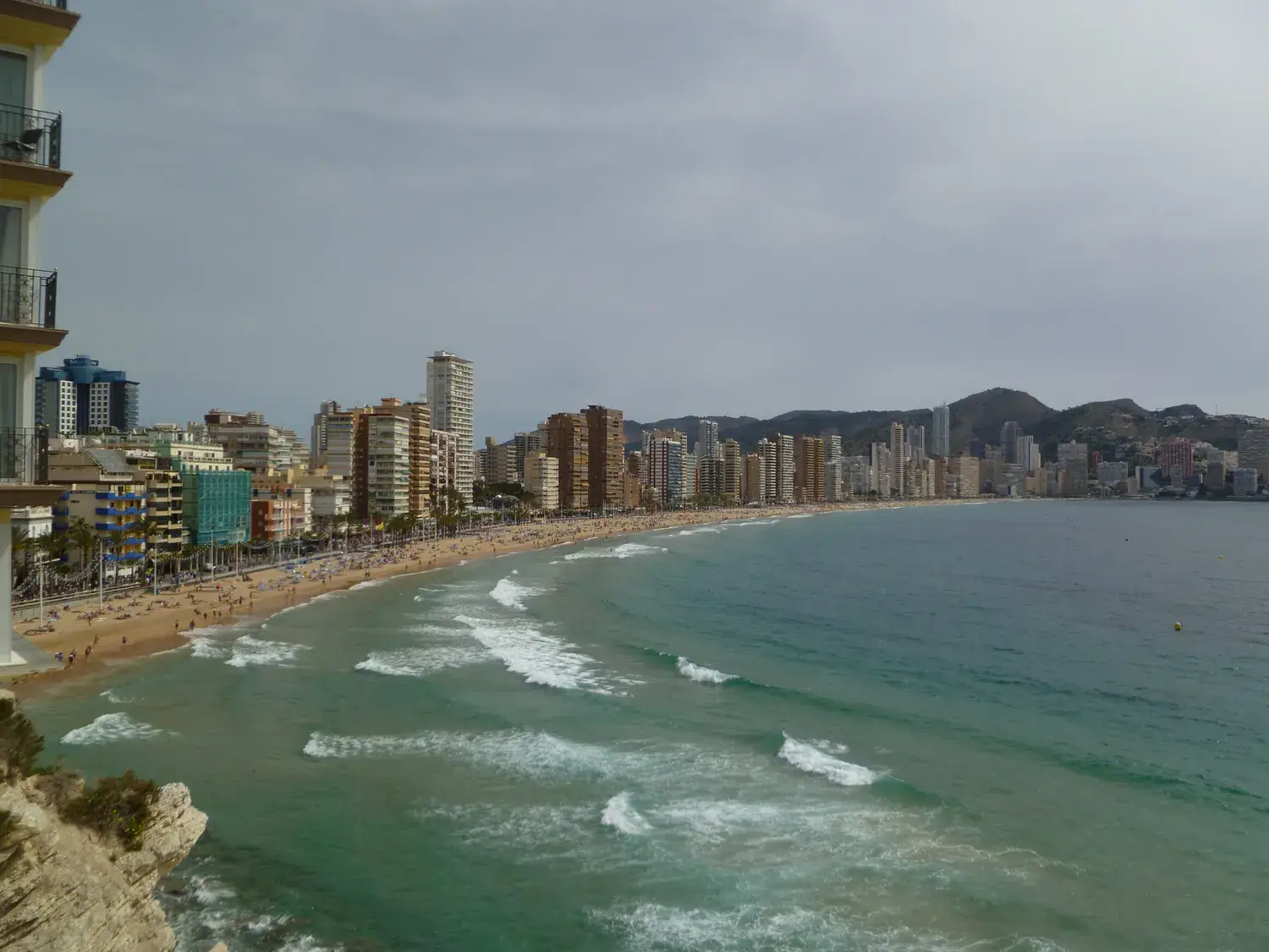The long Levante beach in Benidorm seen from the promenade, with the skyscrapers
