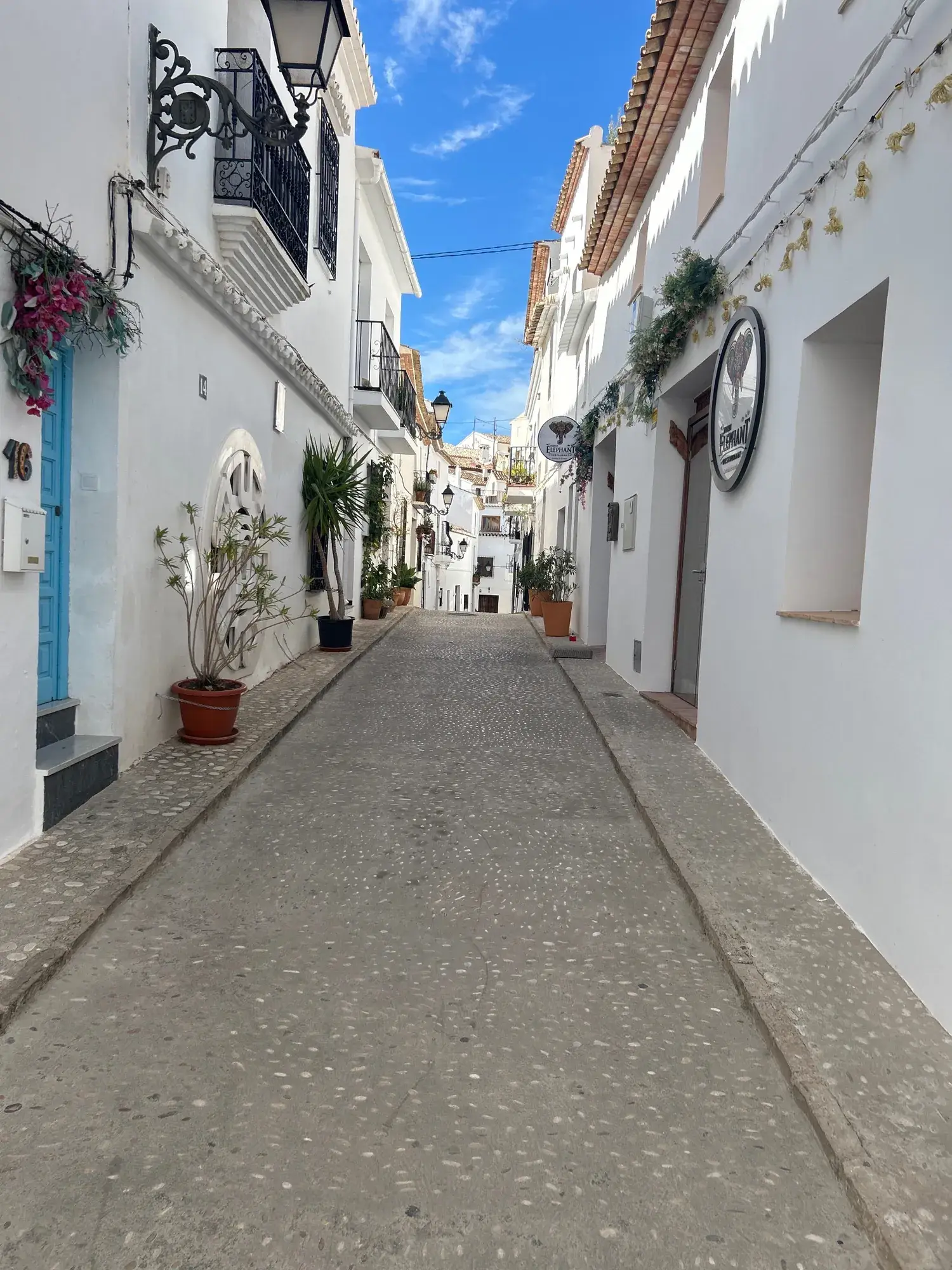Cobbled lane in Altea’s old town lined with white houses